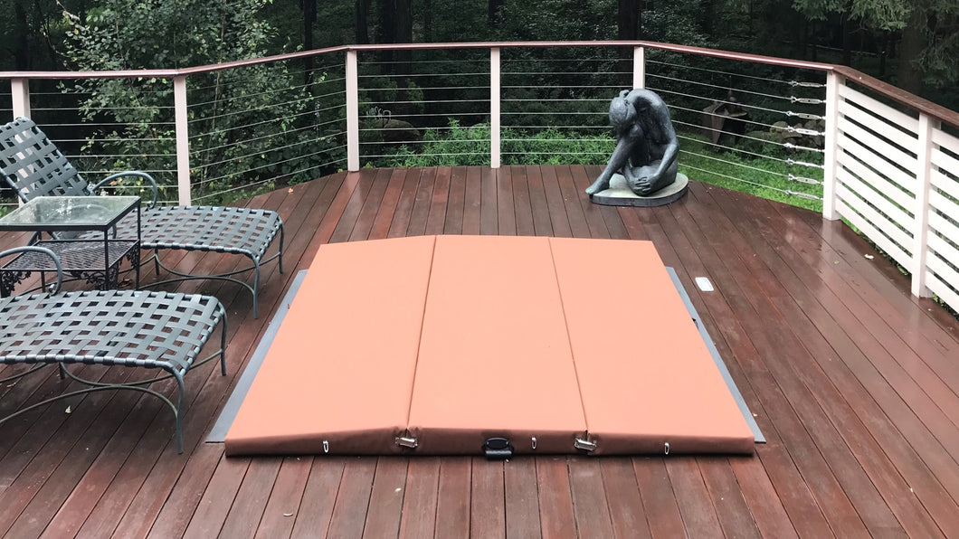 Three panel cinnamon spa cover on an in deck spa