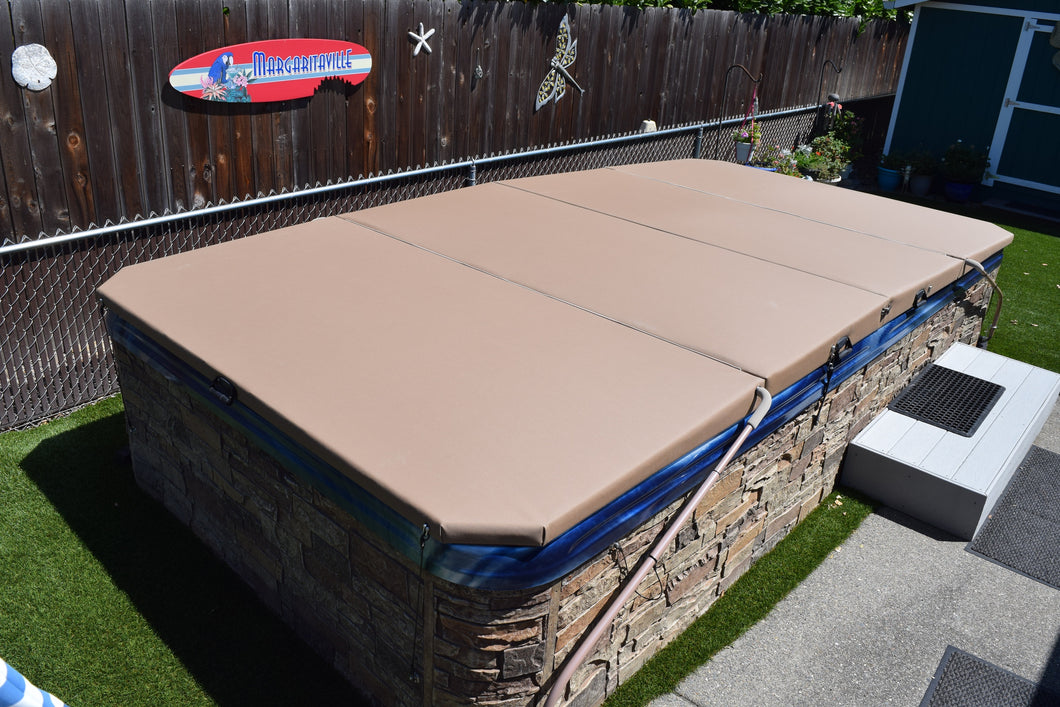 Four panel cover closed on a large swim spa